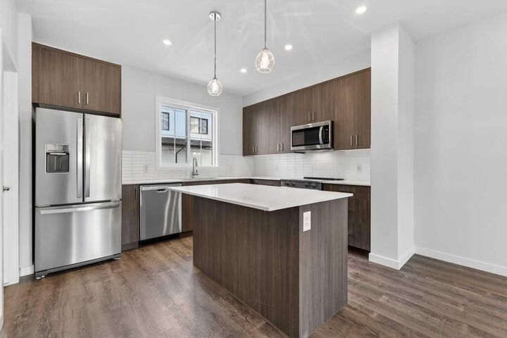 Property Photo: 40 Creekside Way SW 105 AB T2X 6E2