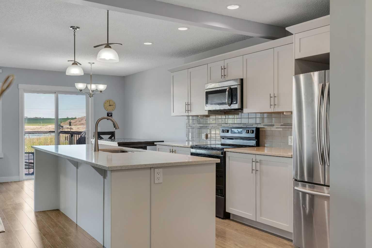Property Photo:  387 Sunrise View  AB T4C 0V3 