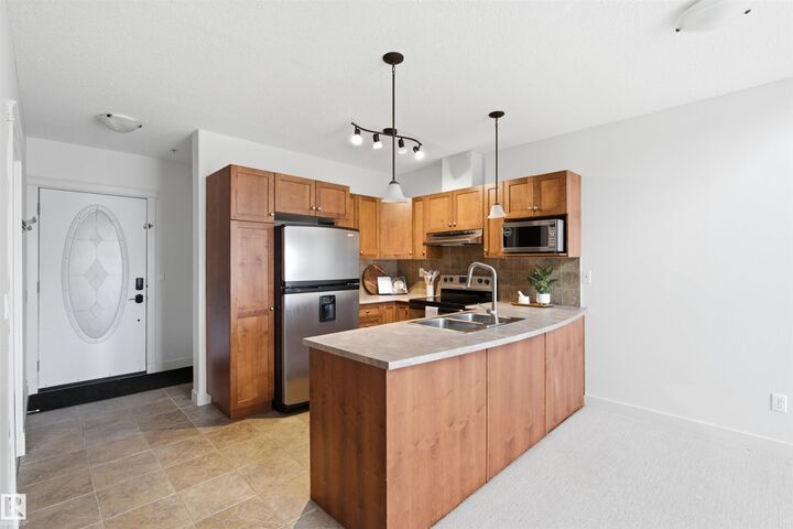 Property Photo:  802 12 Street 407  AB T9M 0A7 