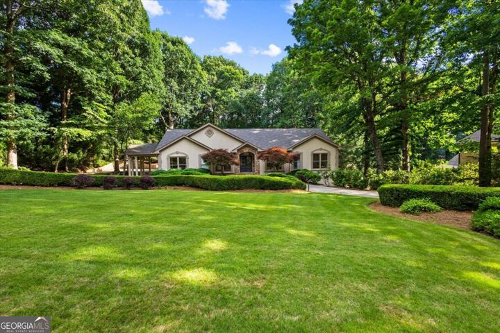 Property Photo:  8920 Huntcliff Trce  GA 30350 