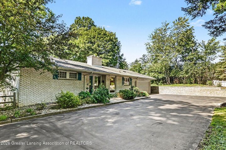 Property Photo:  4811 Delta River Drive  MI 48906 