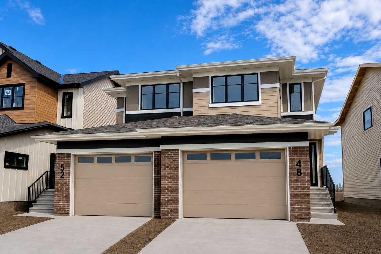 Property Photo: 52 Heritage Point AB T4C 2J8