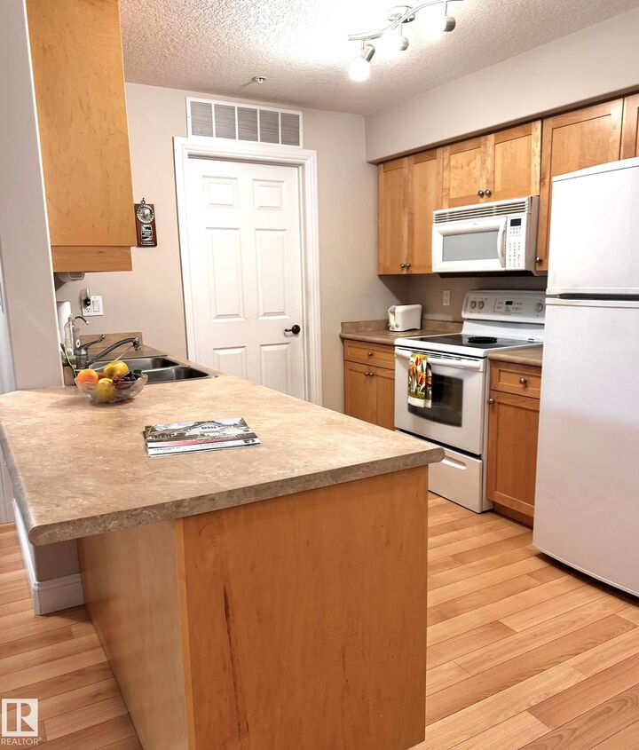 Property Photo: 13111 140 Avenue NW 330 AB T6V 0B1