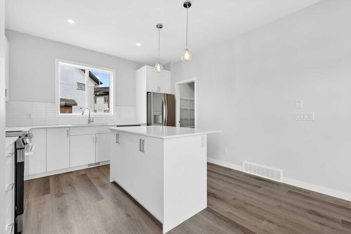 Property Photo:  132 Red Embers Link NE 1025  AB T3N 2X8 