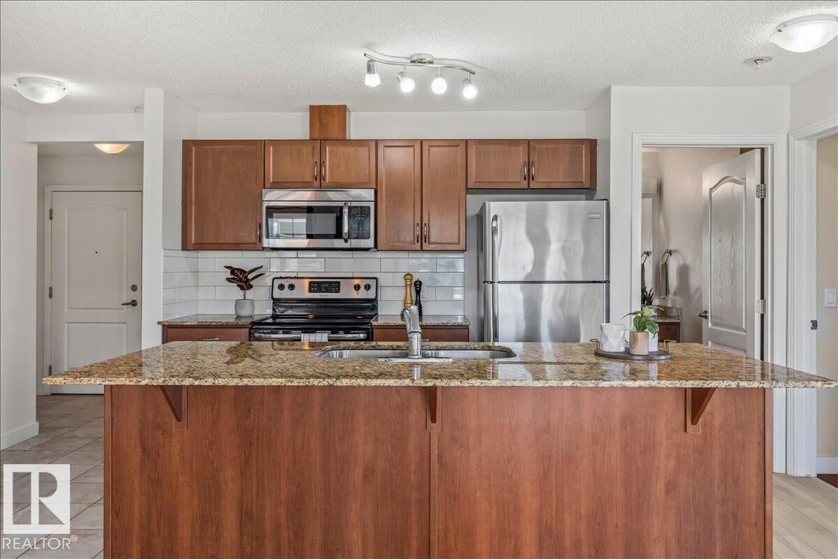Property Photo:  12650 142 Avenue NW 114  AB T5X 0J5 