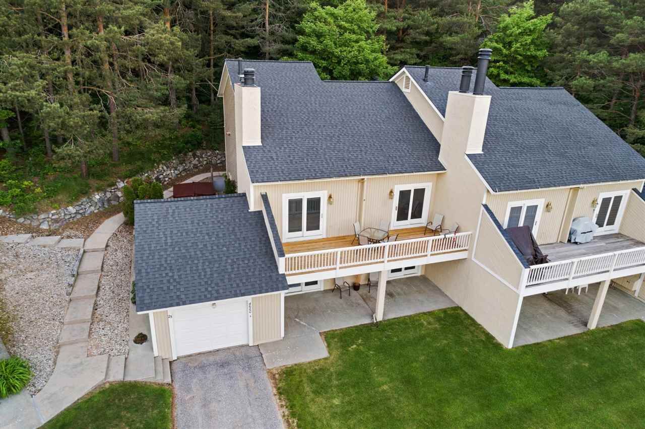 Property Photo:  4680 Camelot 23  MI 49740 