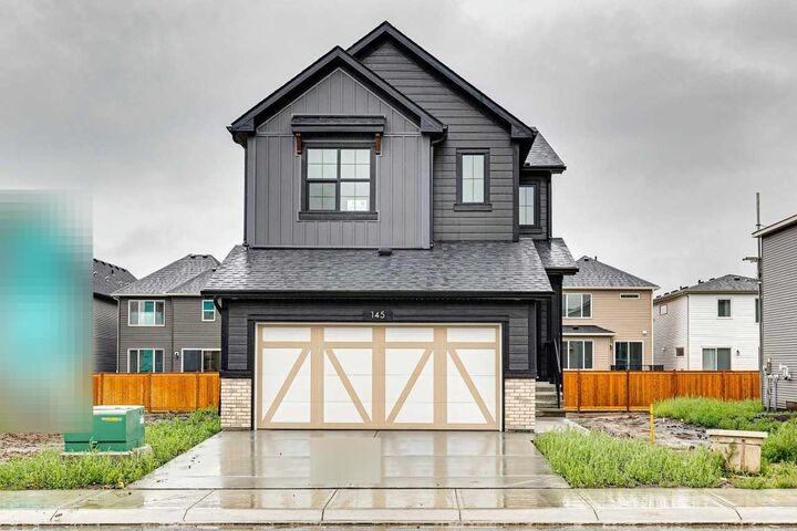 Property Photo: 145 Snowberry Common SE AB T3M 4G6