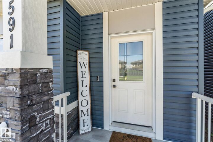 Property Photo:  591 Meadowview Drive  AB T8L 0X1 