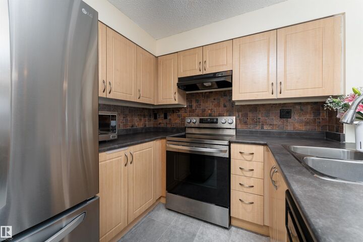 Property Photo: 11441 Ellerslie Road SW 317 AB T6W 1S9