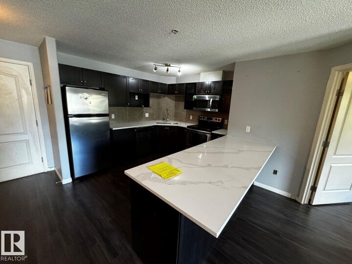 Property Photo:  9357 Simpson Drive NW 2211  AB T6R 0N3 