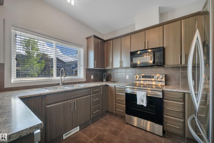 Property Photo:  450 McConachie Way NW 36  AB T5Y 0S8 