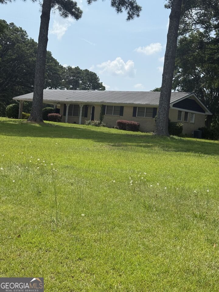 Property Photo:  7359 Pleasant Hill Road  GA 30058 
