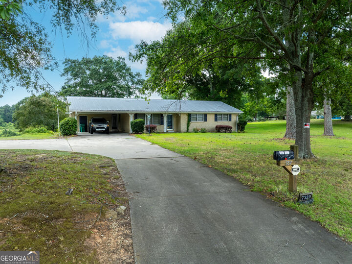 Property Photo: 7359 Pleasant Hill Road GA 30058