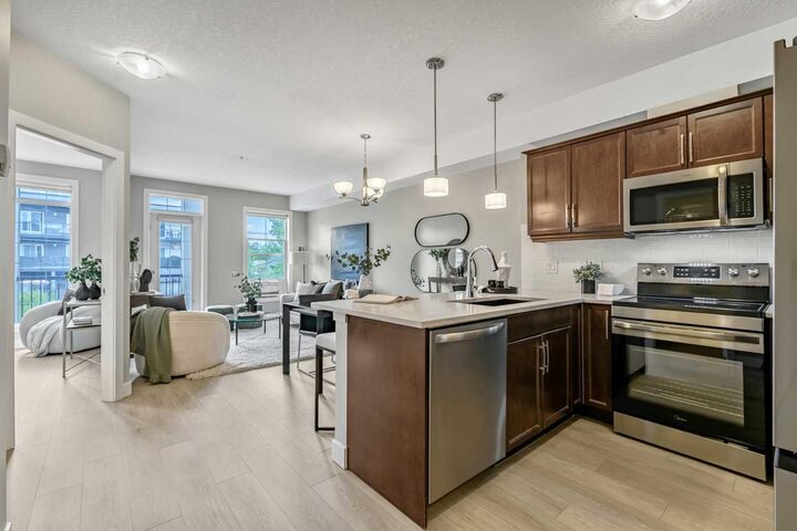 Property Photo:  15304 Bannister Road SE 211  AB T2X 0M8 