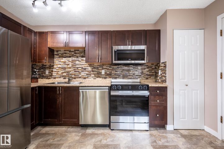 Property Photo:  100 Forest Grove  AB T8N 3K6 