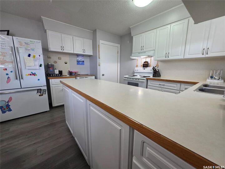 Property Photo:  303 13th Avenue NE  SK S9H 2V9 