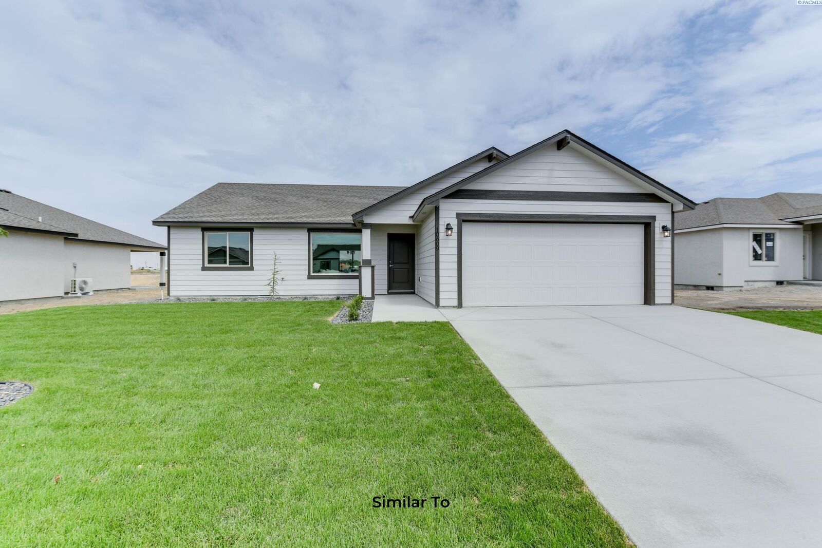 Property Photo:  10123 Redbud Dr  WA 99301 