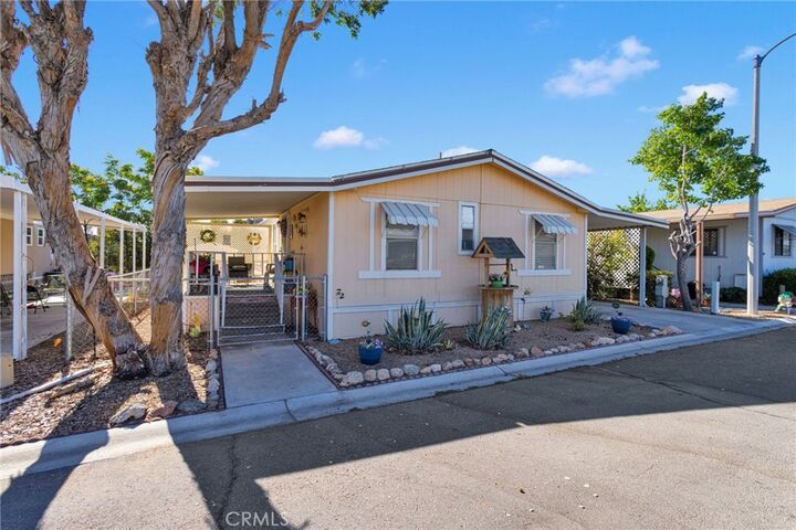 Property Photo:  9161 Santa Fe E 72  CA 92345 