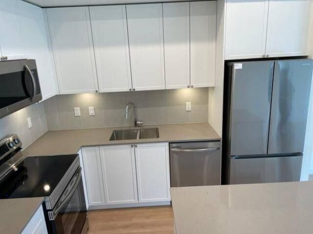 Property Photo: 14778 106 Avenue 617 BC V3R 5Y1