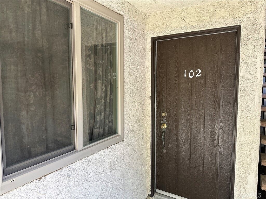 Property Photo: 7055 Etiwanda Avenue 102 CA 91335