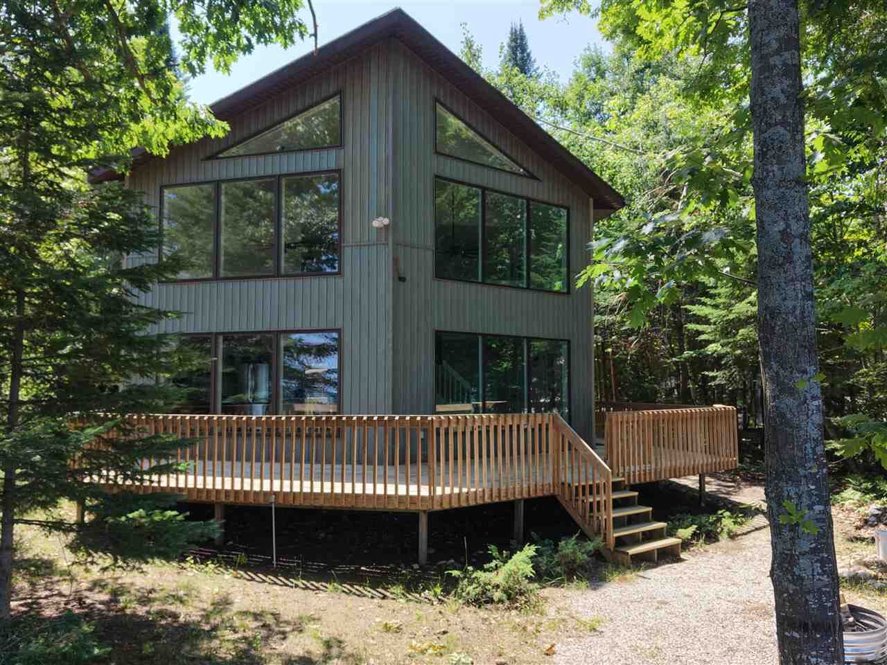 Property Photo:  8751 Cordwood  MI 49721 