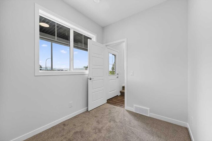 Property Photo: 28 Red Embers Plaza NE 205 AB T3N 2W1