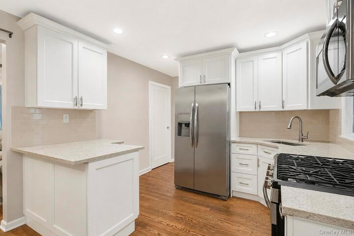 Property Photo: 52 E Fenimore Street NY 11580