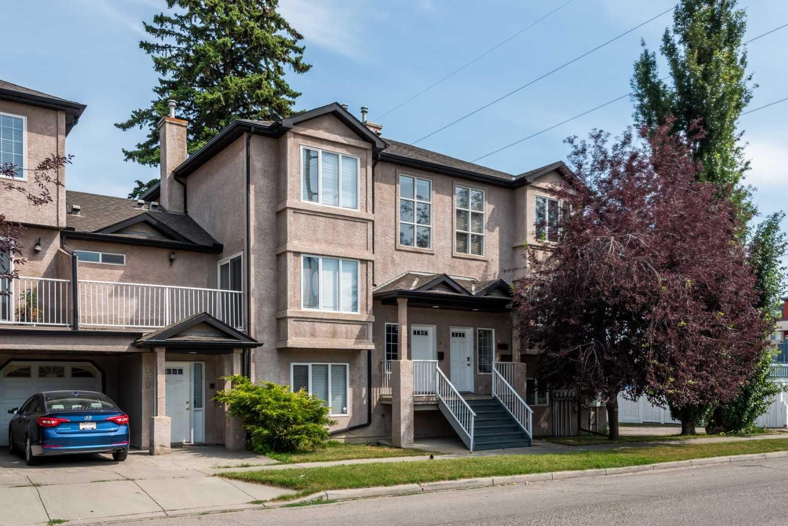 Property Photo:  128 22 Avenue NW  AB T2M 4W2 