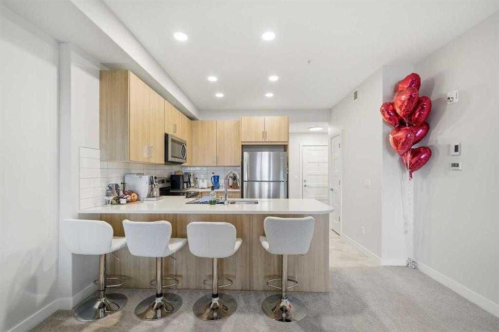 Property Photo: 55 Wolf Hollow Crescent SE 318 AB T2X 5K9