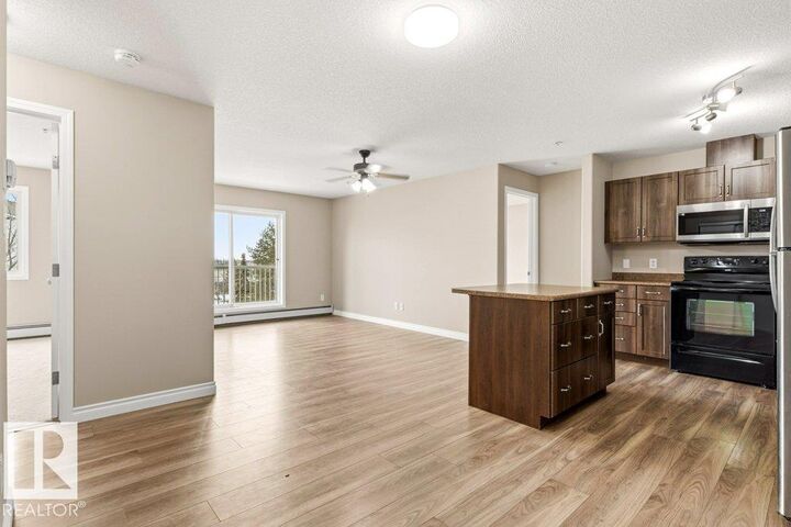 Property Photo: 50 Woodsmere Close 336 AB T8L 4N9