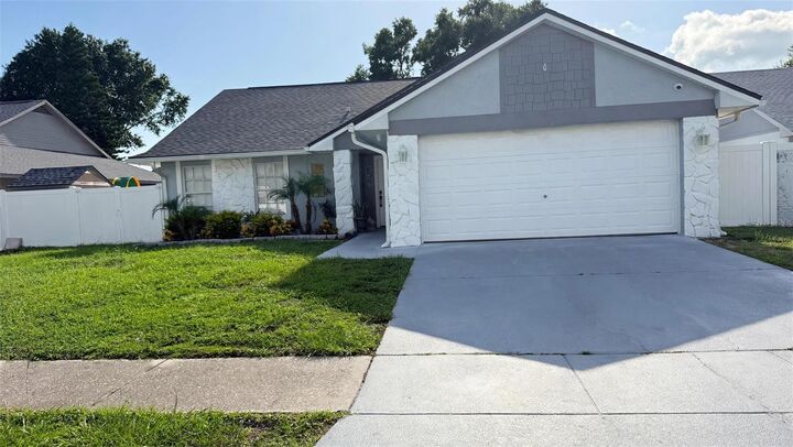 Property Photo:  7102 Hollowell Drive  FL 33634 