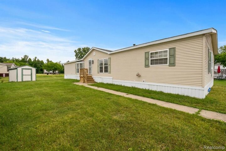 Property Photo:  9327 Greentree Drive  MI 48166 9561 