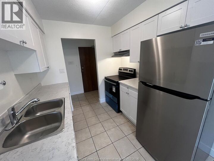 Property Photo:  11822 Tecumseh Road East 105  ON N8N 1L7 
