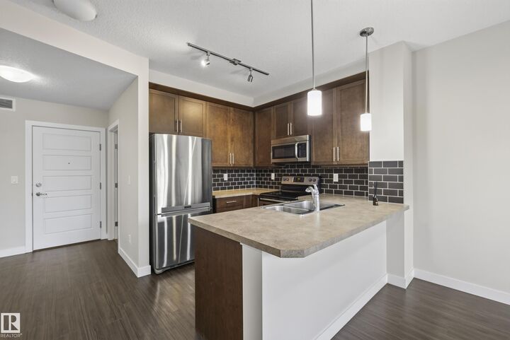 Property Photo: 2588 Anderson Way SW 206 AB T6W 0R2