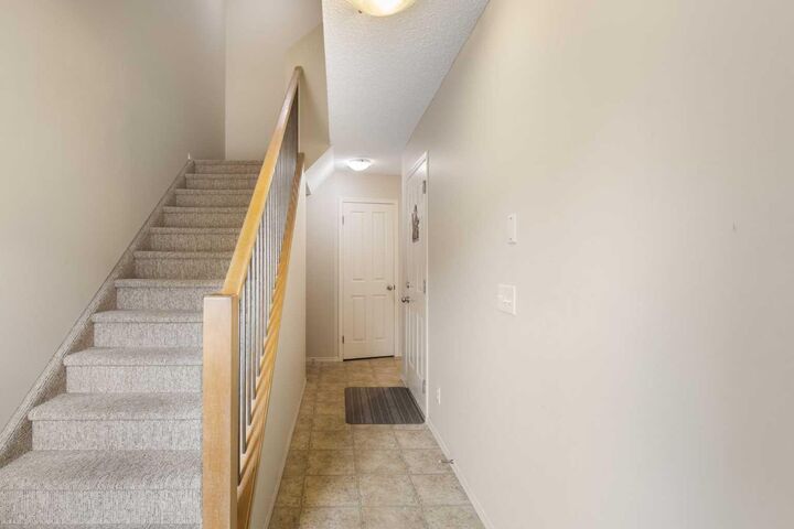 Property Photo: 17 Panatella Villas NW AB T3K 0G7