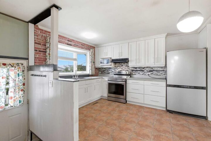 Property Photo:  7807 Olympia Bay SE  AB T2C 1N7 
