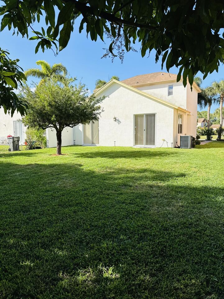 Property Photo: 5780 Azalea Circle FL 33415