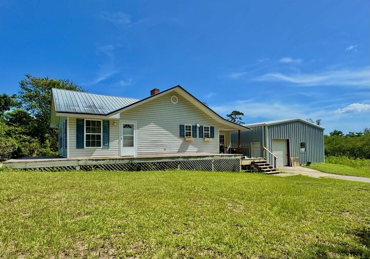 Property Photo:  839 NE Post Road  FL 32340 