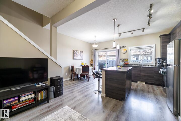 Property Photo: 3710 Allan Drive SW 4 AB T6W 2C4