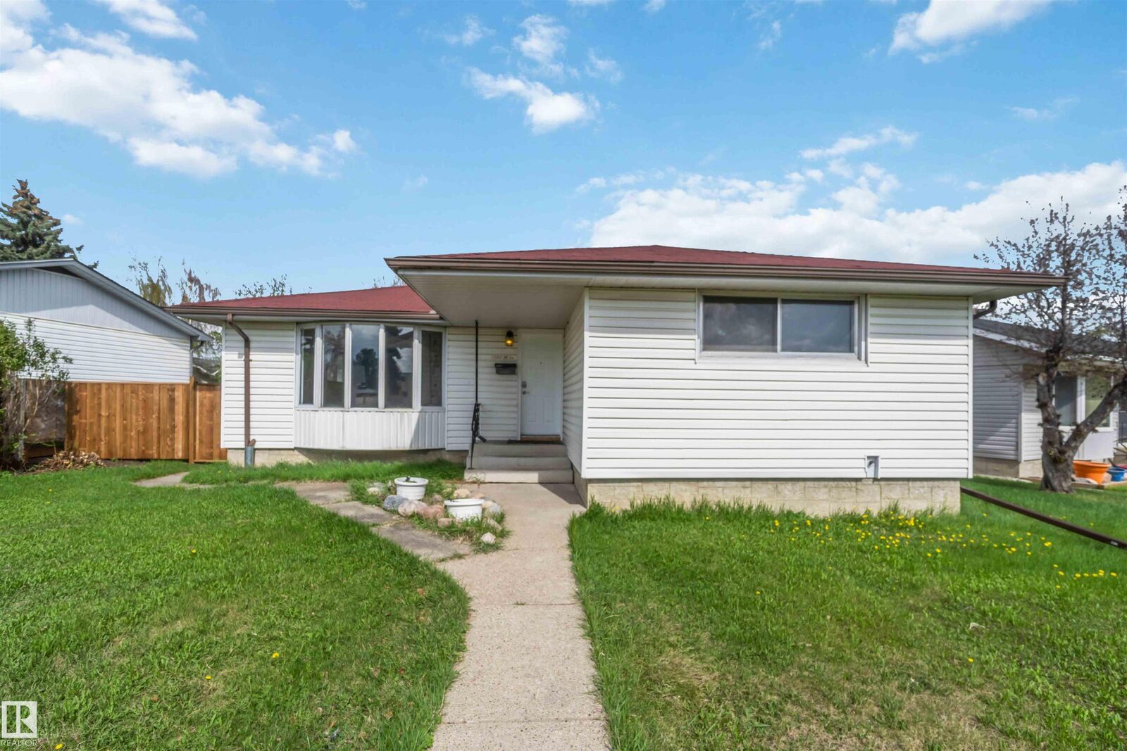 Property Photo: 13303 58 Street NW AB T5A 0P9