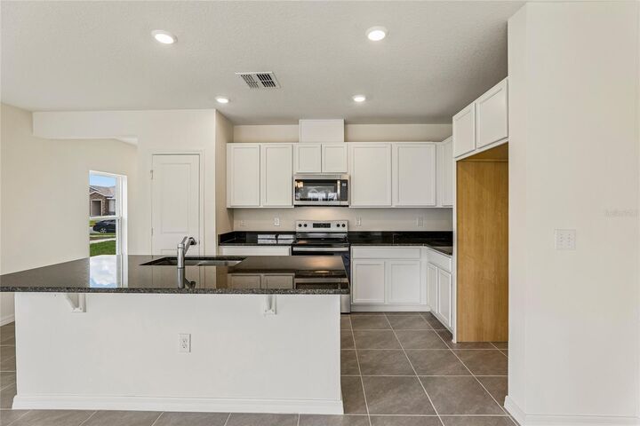 Property Photo: 679 Meadows Edge Place FL 33859