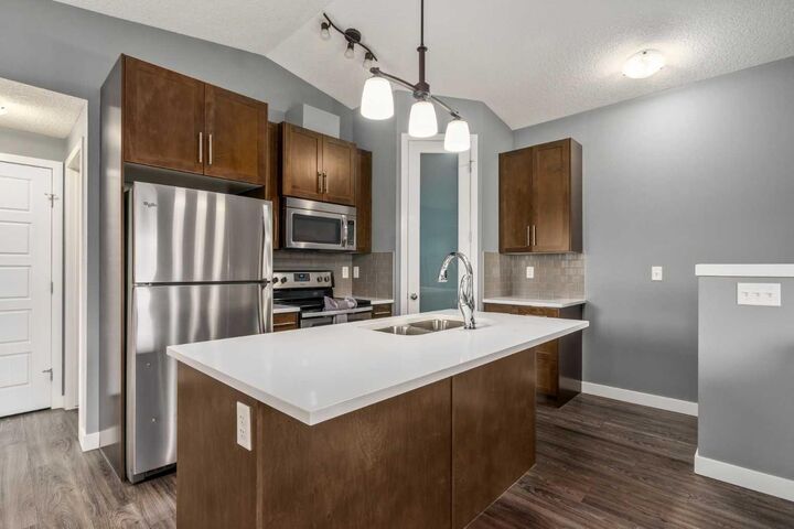 Property Photo: 2461 Baysprings Link SW 1324 AB T4B 4C6