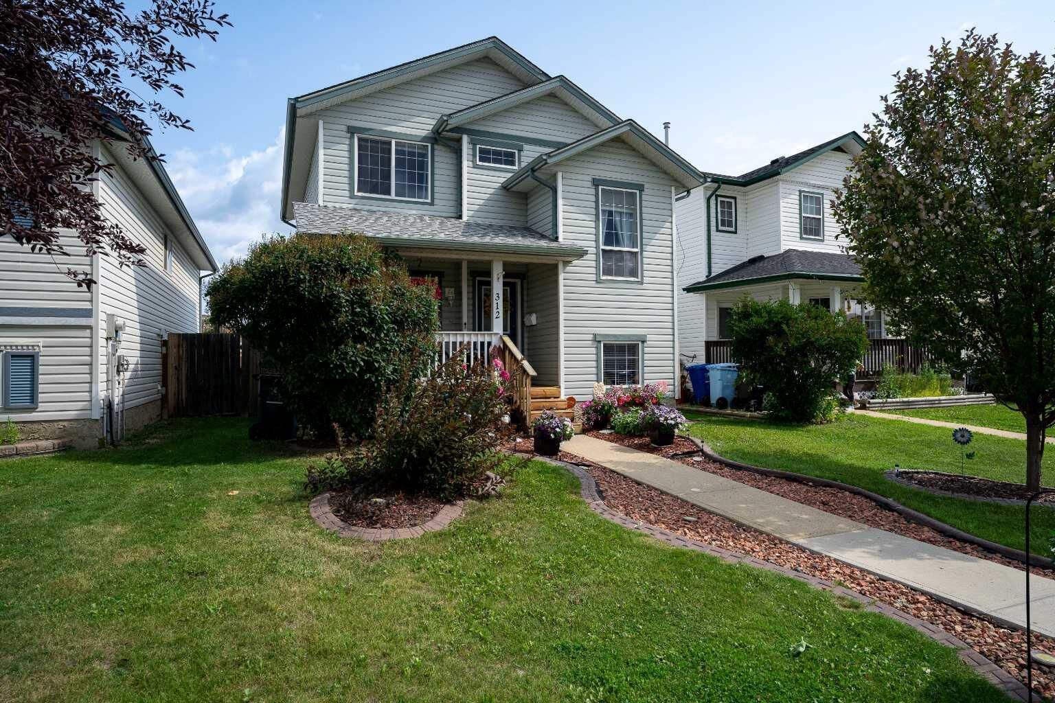 Property Photo: 312 Diefenbaker Drive AB T9K 2K1