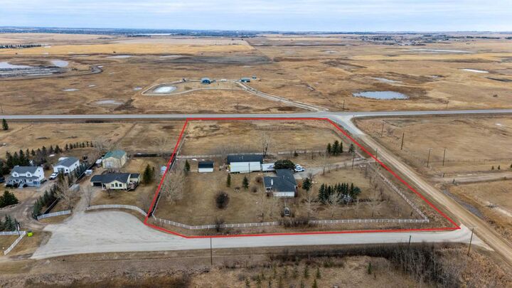 Property Photo: 233239 Glenmore View Road AB T1X 0H3