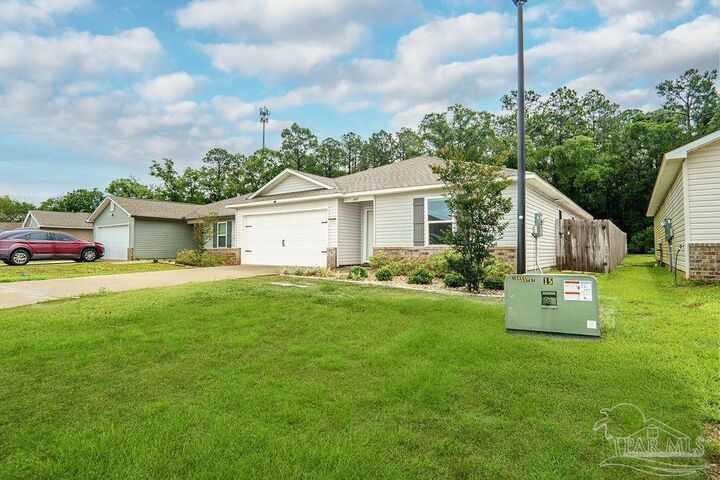 Property Photo:  6469 June Bug Dr  FL 32583 