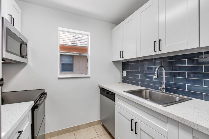 Property Photo:  450 SW 2nd Avenue 205  FL 33432 