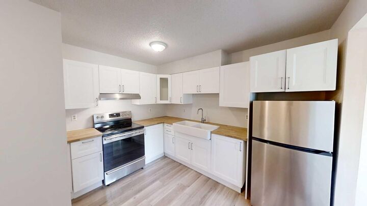 Property Photo:  5117 44 Street 114  AB T0G 1E0 