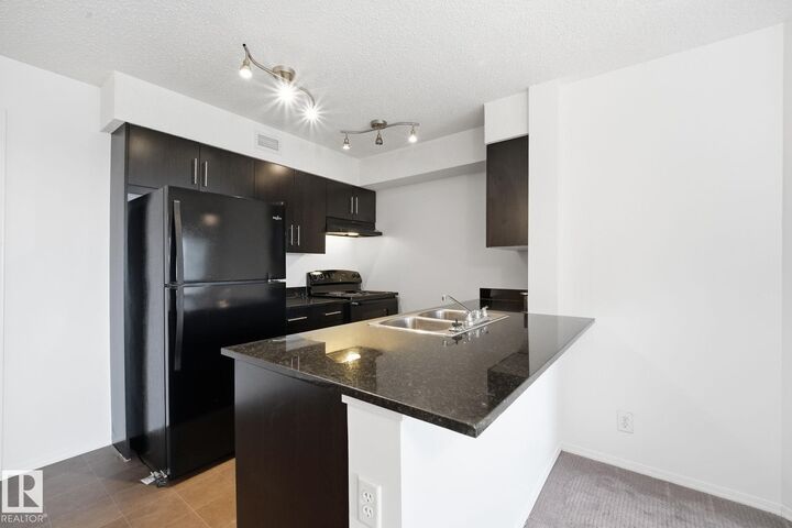 Property Photo:  11804 22 Avenue SW 314  AB T6W 2A2 