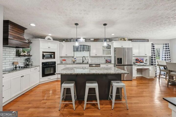Property Photo:  6471 Forsyth Drive  GA 30028 
