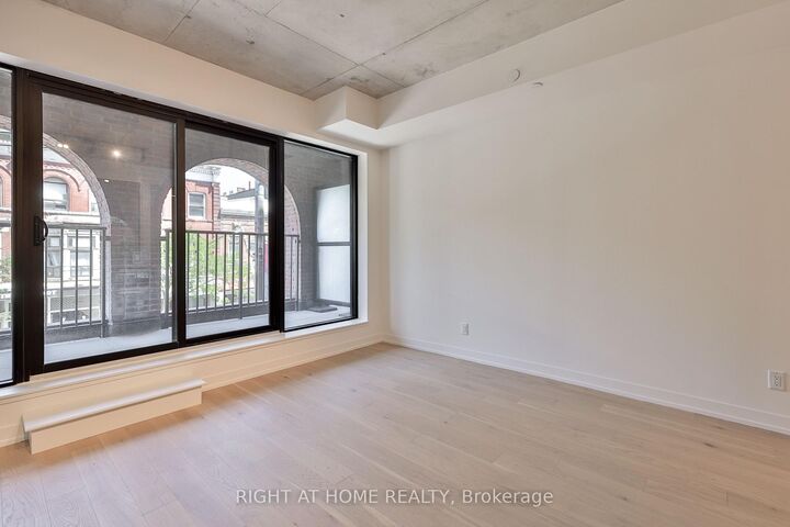 Property Photo:  761 Queen Street E 203  ON M4M 1H3 